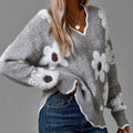 THEA | ELEGANTE TRUI MET V-HALS EN BLOEMENPRINT