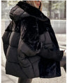 Oversized pufferjack met capuchon van imitatiebont – ultrawarme streetstyle
