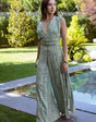 Isla Luxe – Jumpsuit met print, open rug en wijde pijpen